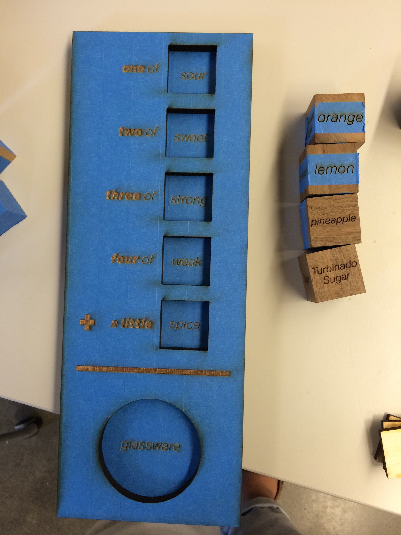 The final board fresh out of the laser cutter and so.me scrap dice with different type treatments