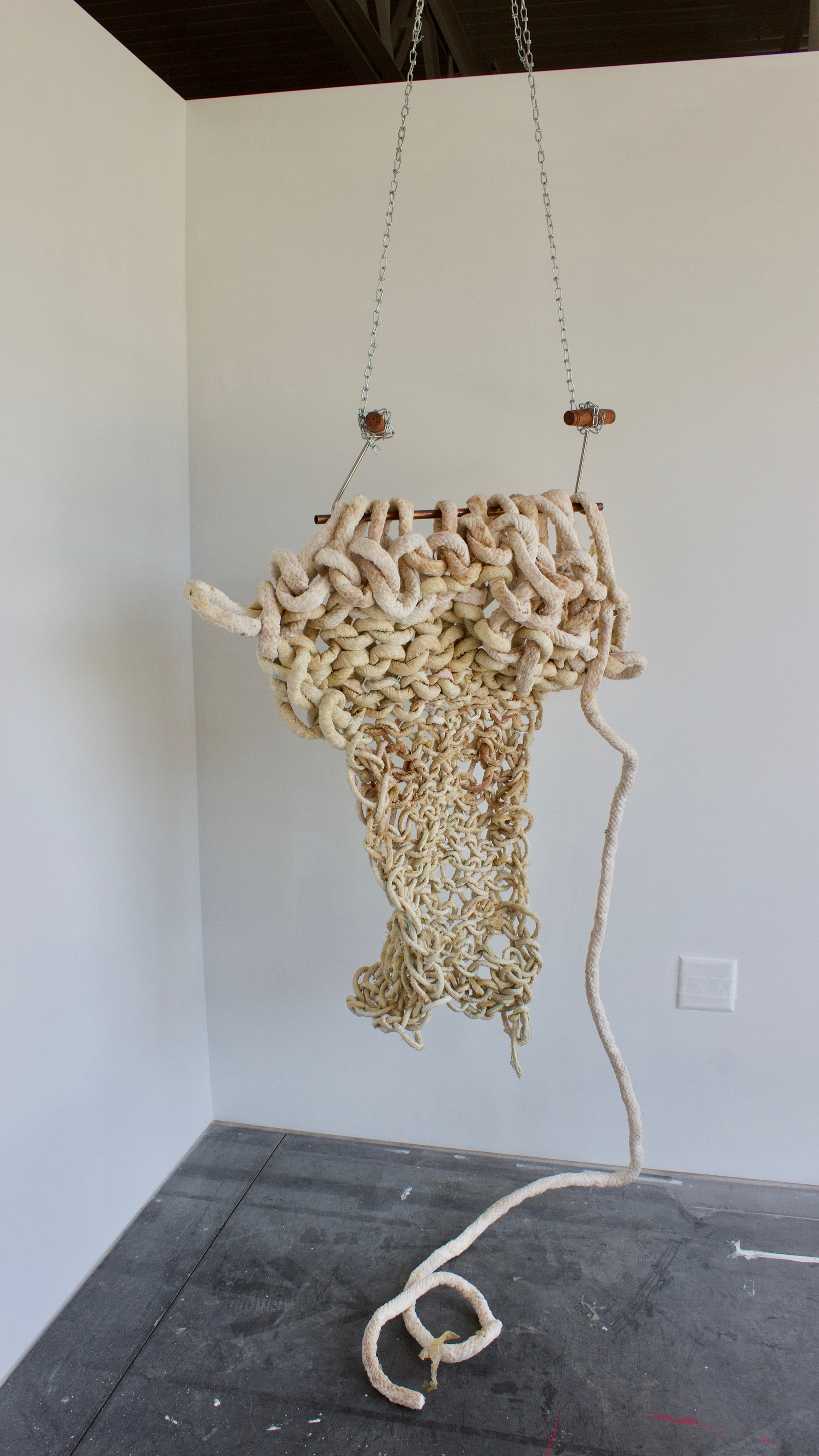 sculptural remnants from an hour and forty minute long performance. Arm knitting latex cord