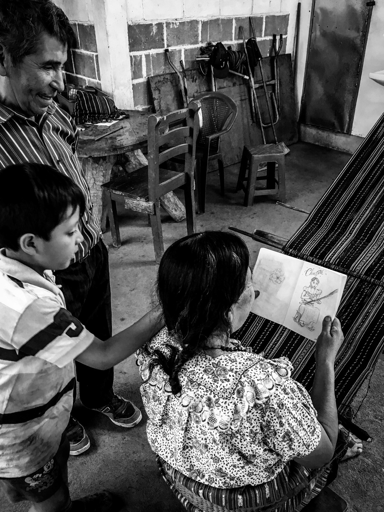 Mama Elena looks at a drawing I did of her daughter, Chusita