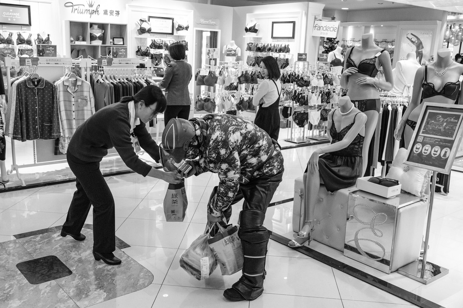 Store employees receiving take-out order, Beijing