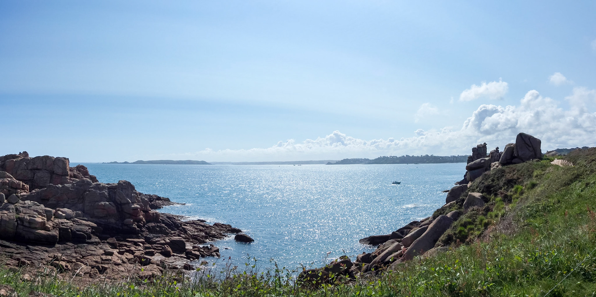 View on Ile Tomé, from one of many small bays along the Sentier des Douaniers. Shimmering sunlight om the English channel.