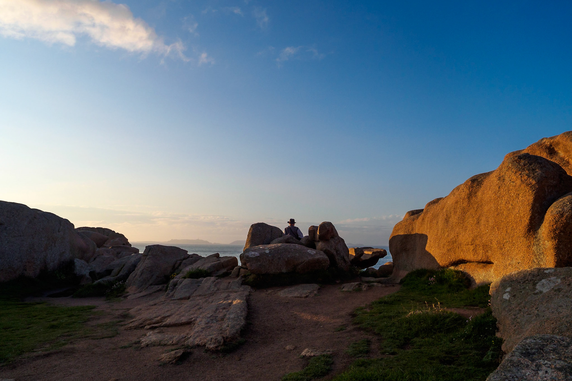 One of the pink granite rocks shaped like a big chair, offering a grandiose view over the islands at Ploumanach, Bretagne, Fance