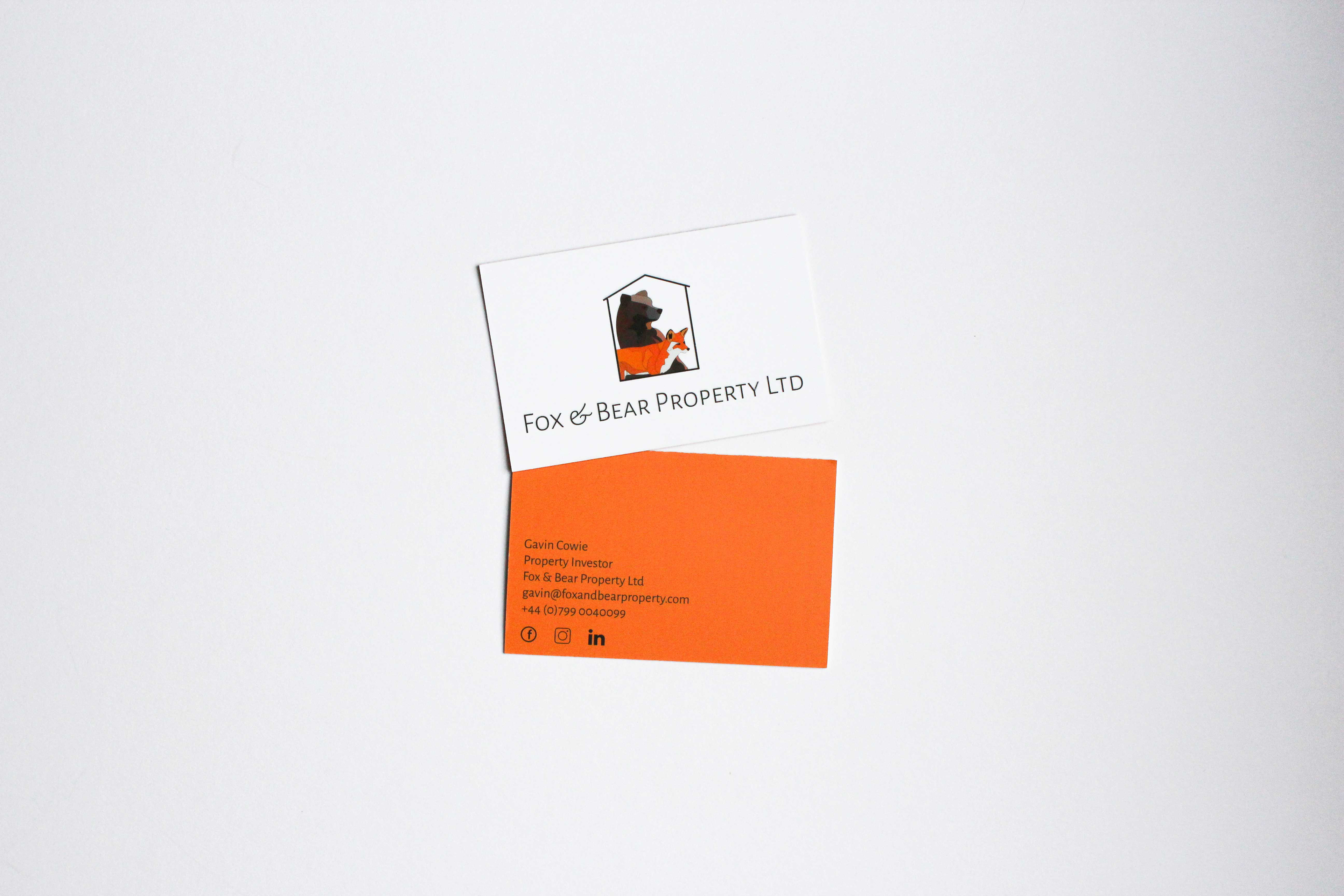 Double sided business card. Fox & Bear logo on front, orange background on the reverse with black text for contact details