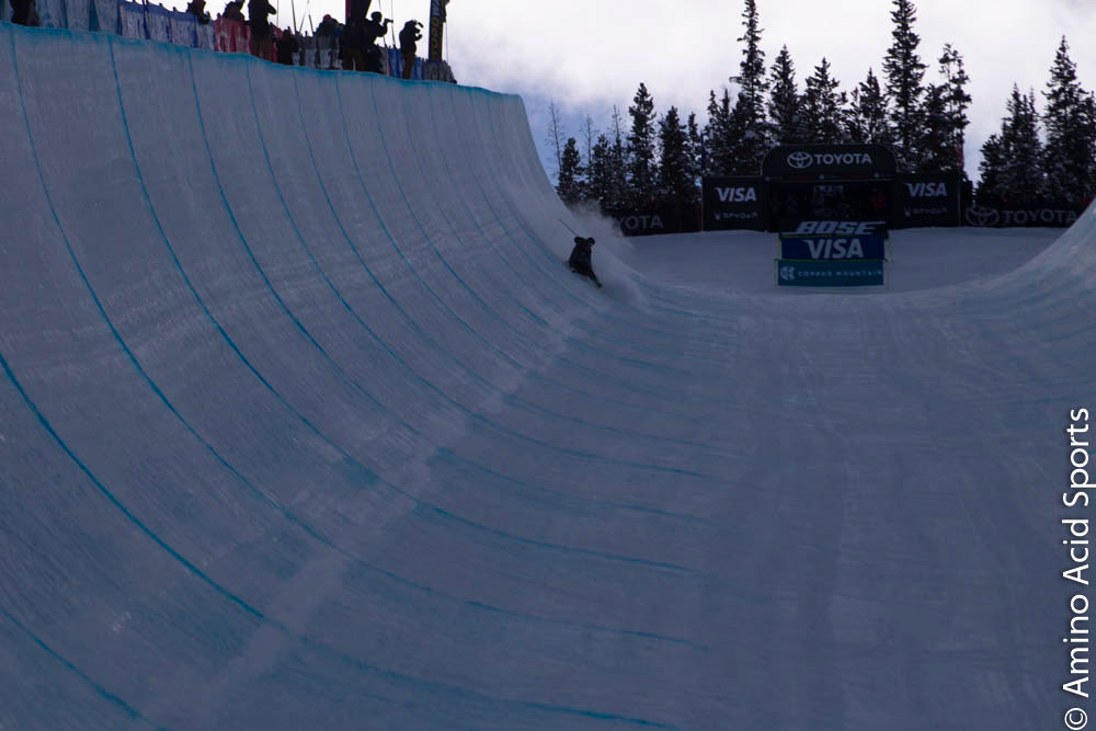 Simon D'Artois, of Quebec, slides his landing at the top of the Halfpipe for a rough 1st Run scratch.