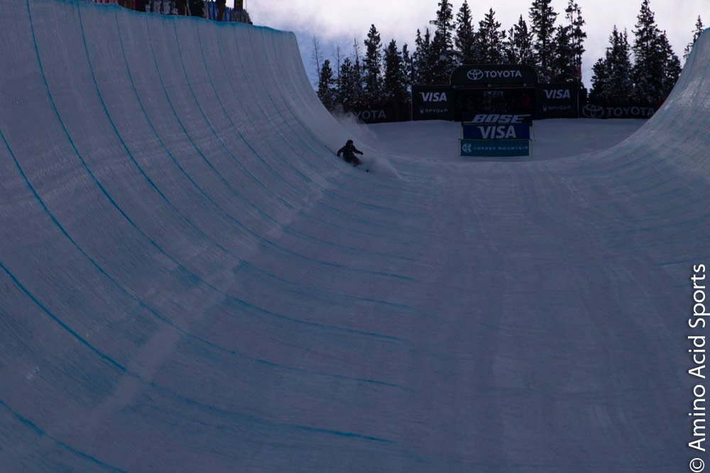 Simon D'Artois, of Quebec, slides his landing at the top of the Halfpipe for a rough 1st Run scratch.