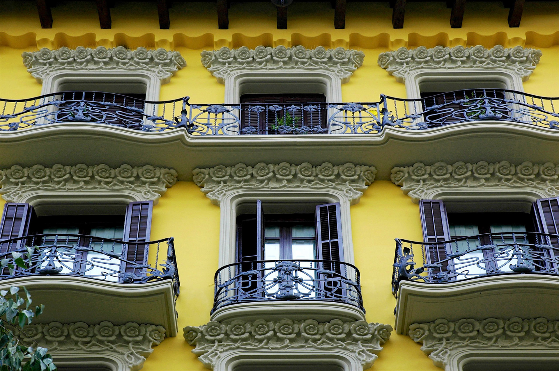 Decorated windows, doors and railings on an apartment building in Barcelona