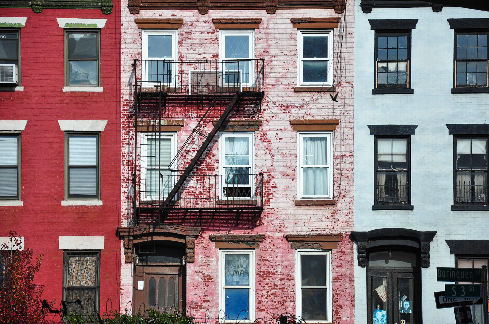 Apartment buildings in Williamsburg, Brooklyn painted three different ways.