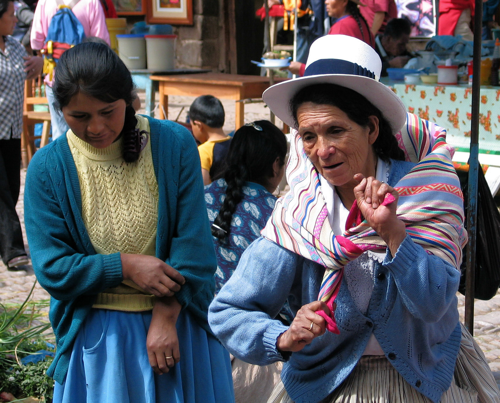 Married women in Peru always dress pleated skirts. Here at the market in Pisac.
