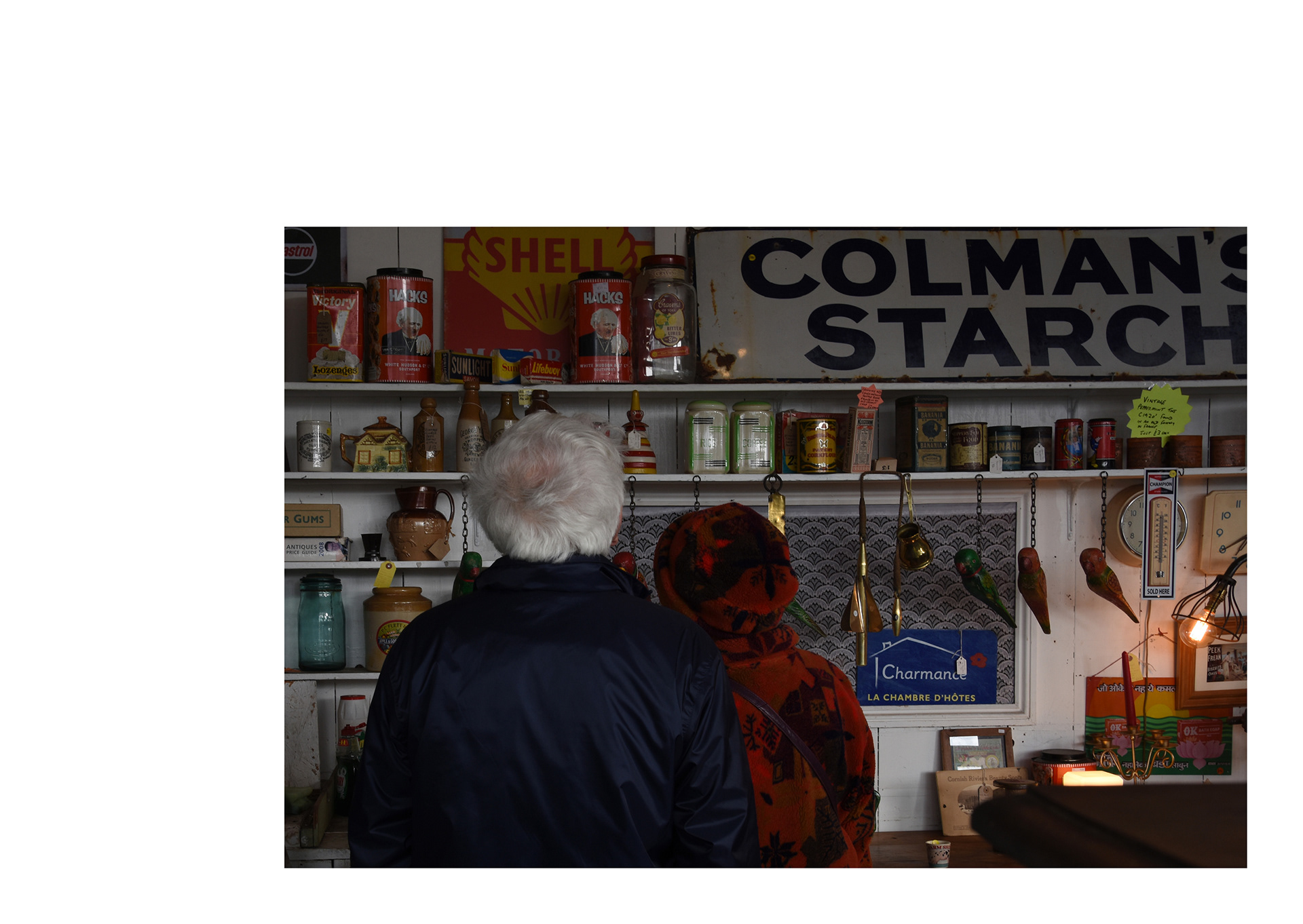 elderly couple inside a vintage shop in hayle in cornwall by freelance photographer melissa carne