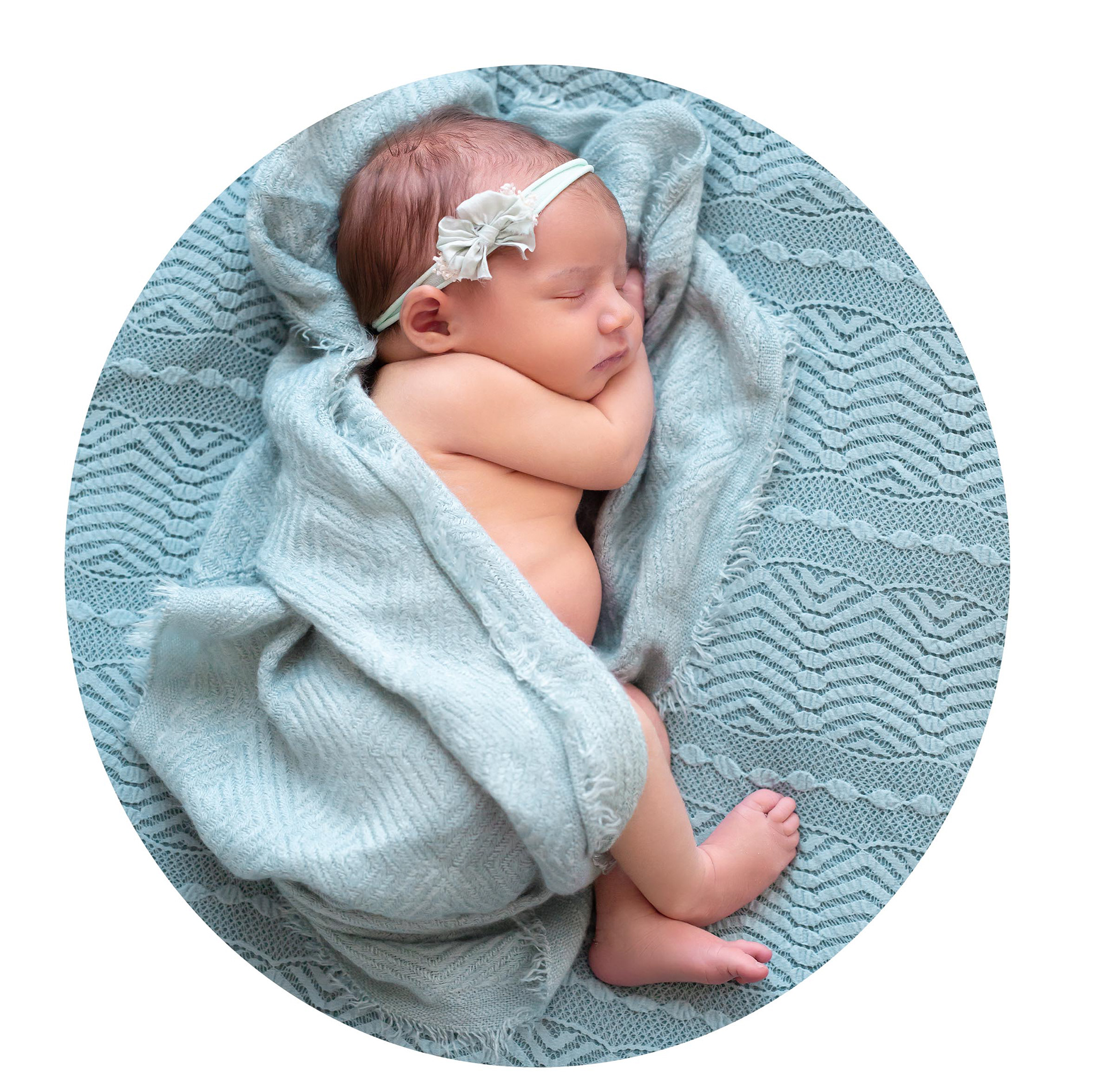 newborn baby girl wrapped in a blanket