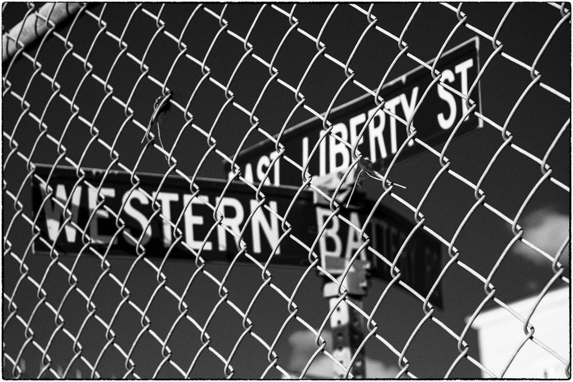 Signage behind a fence