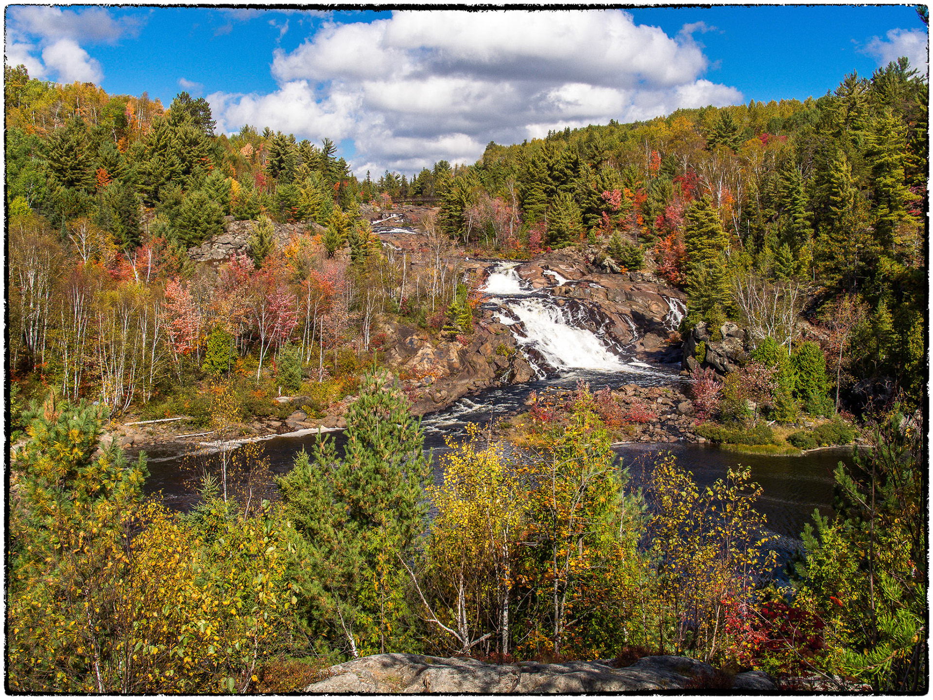 The High Falls of the Onaping River in mid fall.