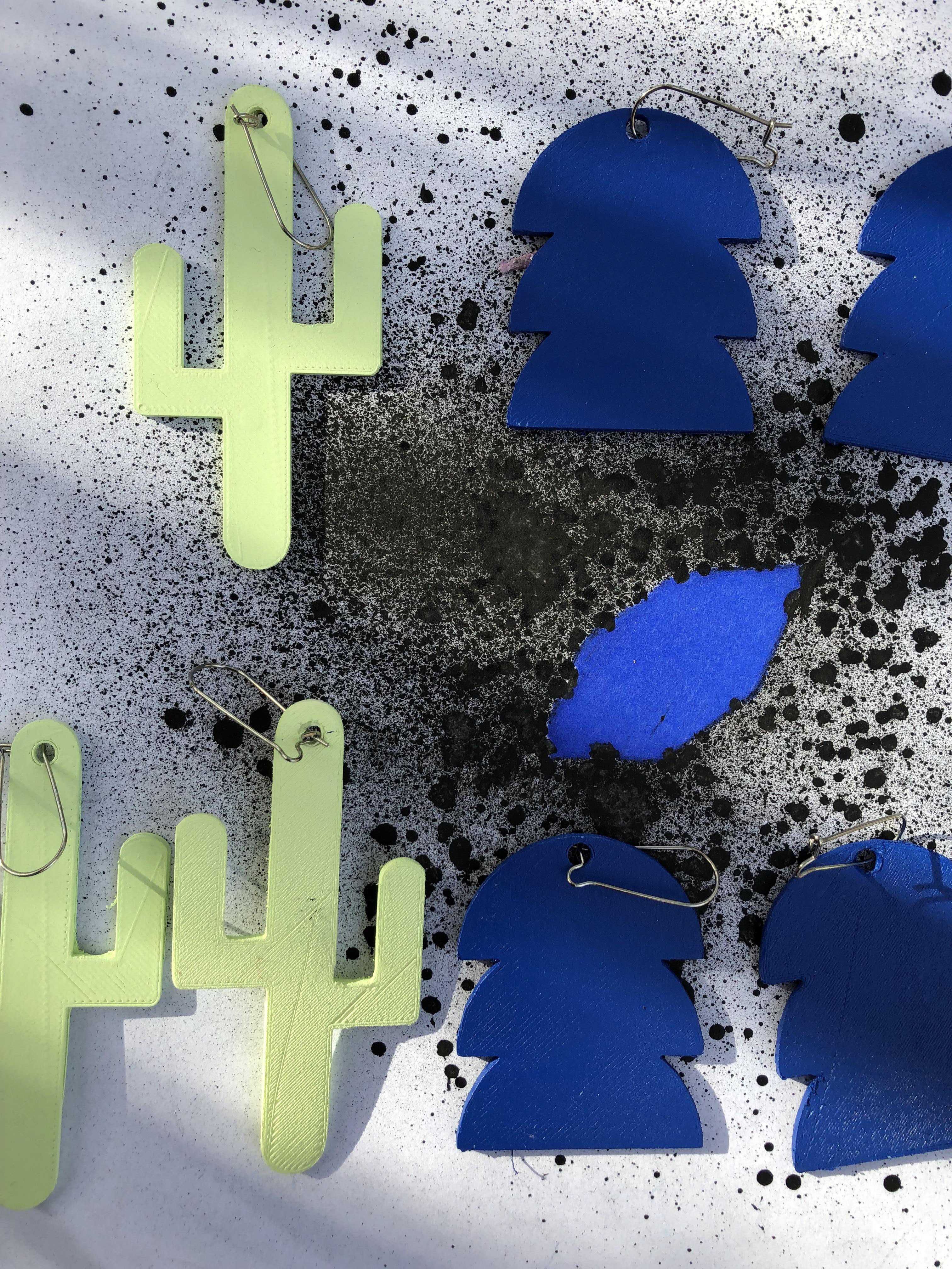 Jewelry designed, 3D printed and painted by me. Logo design also by me, in Adobe Illustrator